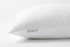 Close-up of soft duck down microfiber king pillow with white cotton cover