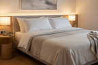 Two luxury duck down blend queen pillows on a bed with neutral linen